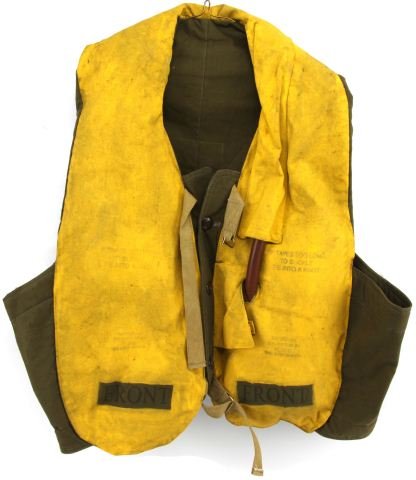 LIFE VEST WORN BY BEN AFFLECK IN PEARL HARBOR FILM: A pattern 32 life vest used in "Pearl Harbor" (2001) worn by Ben Affleck as "Rafe McCawley". This vest is an authentic vest and has a label attached which reads " Pearl Harbor / Costume Dept. / Holds 
