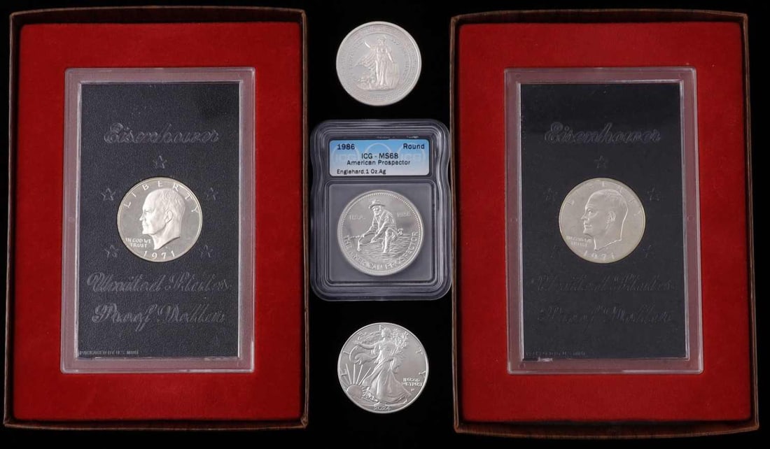 COIN LOT 2 IKE BROWN 1 SILVER EAGLE 2 1 OZT ROUNDS: Two boxed Ike browns, 2024 silver American Eagle, and 2 1 OZT ounce silver rounds. This lot reserved at melt.