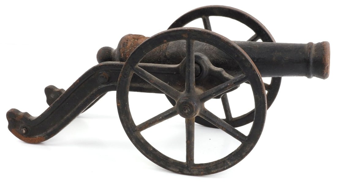 CAST IRON MINIATURE CANNON: Appears fireable. 11 X 4 inches.