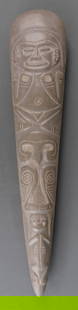 PRECOLUMBIAN TAINO CARVED CELT AXE HEAD: Pre-Columbian Taino (1000-1500 CE) carved ceremonial axe head, commonly known as a celt. This celt is carved with five figures: a female human figure, two birds, and two monkeys. 4.5 X 21 inches. Prov