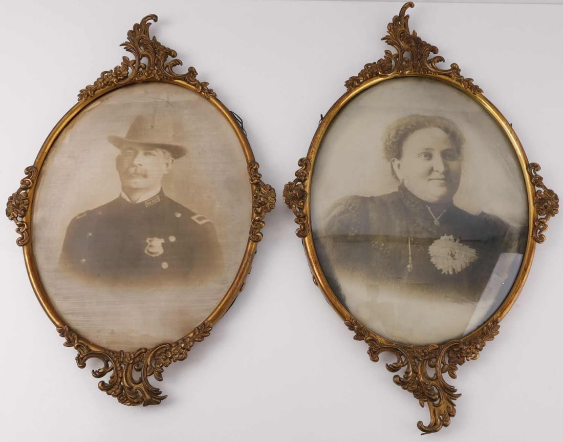 CONVEX PHOTOGRAPHS OF POLICE OFFICER & WIFE: Paired, framed photographs of married couple. The man is dressed as a police officer. The female figure is under bubble glass. 13 X 10 inches each. Very good condition.