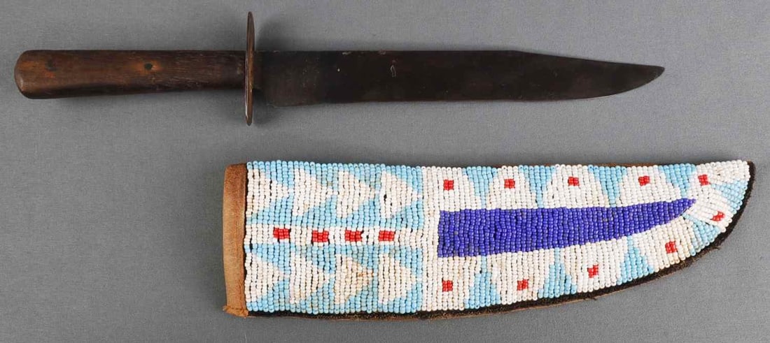 ANTIQUE INDIAN FIGHTING KNIFE W BEADED SHEATH: Unmarked knife in very good, original condition. Includes beaded leather sheath.12.5 inches overall. Blade is dark, but very good pitting and rust free.