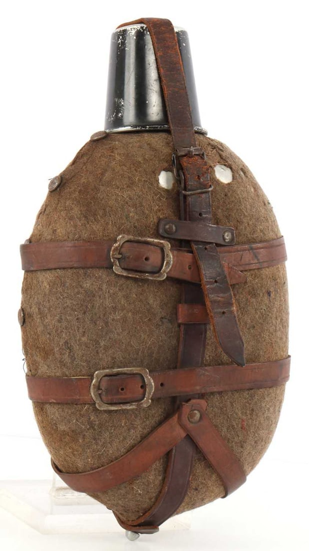 WWII BULGARIAN ARMY ROYAL CAVALRY GUARD CANTEEN: Third Reich made coconut-style canteen for the Bulgarian royal cavalry guard. This is much larger than a standard coconut canteen, with a 12-inch height and 6-inch diameter at the belly. Some mothing