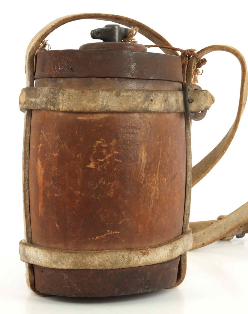BRITISH EMPIRE ZULU WAR COLONIAL AFRICA CANTEEN: British canteen from the colonization of Africa, this model being associated closely with the Zulu Wars. Dated to 1879 on rim, further connecting to the Zulu War. Wood with cloth carrying strap, iron 