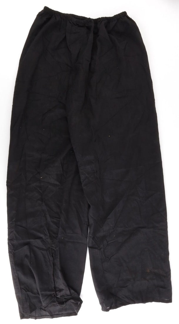 VIETNAM WAR VIET CONG BLACK MILITARY PANTS: Black pants consistent with those used in Vietnamese agricultural labor and commonly worn by soldiers for the National Front for the Liberation of South Vietnam,or Viet Cong. Pajama-style with a light