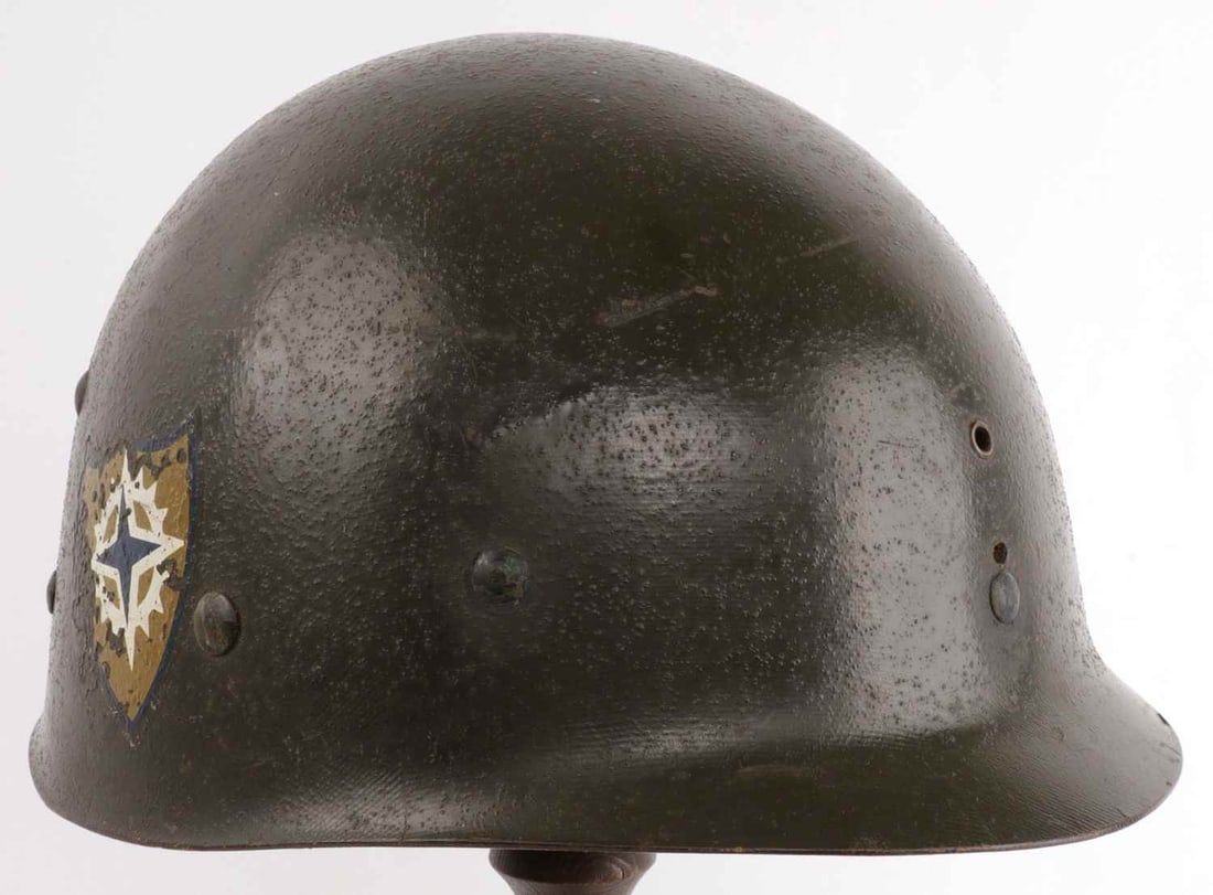 KOREAN WAR US ARMY XVI CORPS M1 HELMET LINER CAPAC: Exterior has insignia of US Army XVI Corps on left and right sides. Dome interior has Capac maker's mark. Chinstrap studs and front insignia eyelet present. Good condition. Some loss of webbing.