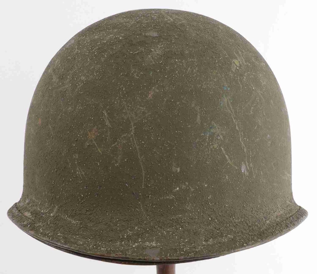 WWII US M1 STEEL COMBAT HELMET & M1C LINER: US M1 helmet and liner. Rear seam, swivel chinstrap loops. No apparent lot code. Front of liner has hole for mounting insignia. Interior has chinstrap studs and Westinghouse maker's mark and "D 5." Go