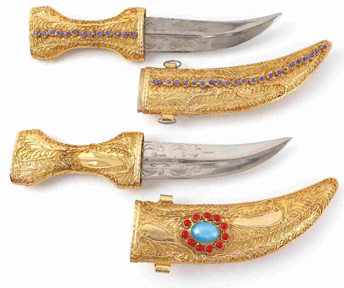 YEMENI JAMBIYA DAGGER FOR DISPLAY LOT OF 2: Two Yemeni jambiya daggers for display. #1 Jambiya dagger. Blade is 6.5 inches and unsharpened. Thick cord metallic cord down either side of blade, which is etched with intricate designs. Sheath is ma