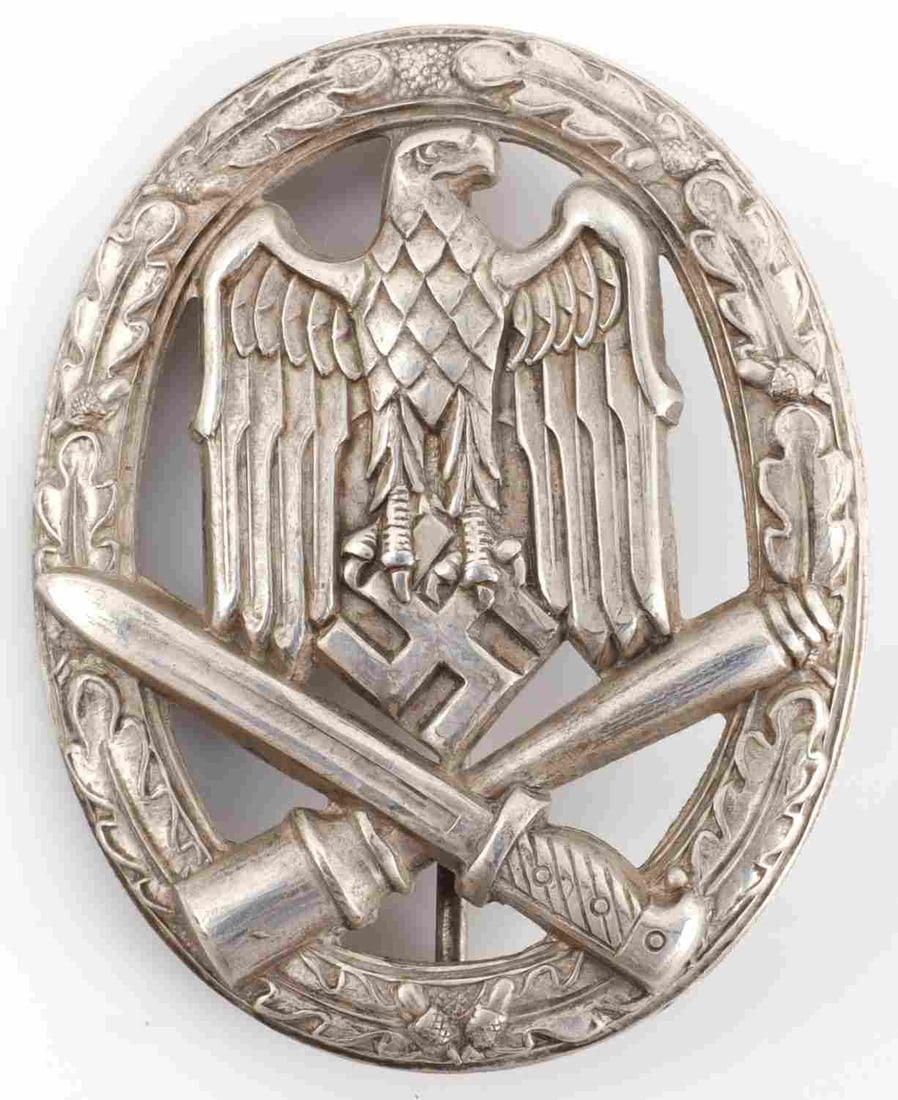 WWII GERMAN GENERAL ASSAULT BADGE: Unmarked hollow back stamped type. Measures 2 1/8 inches. Very good condition. This lot has a reserve.