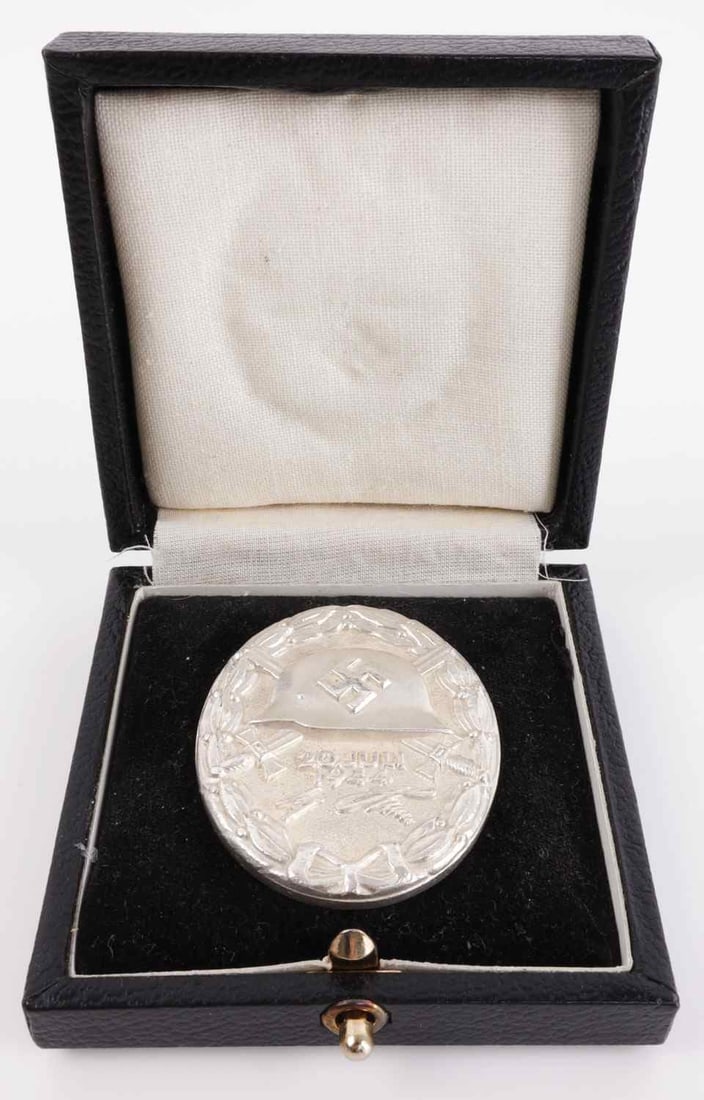 WWII GERMAN JULY 20 1944 SILVER WOUND BADGE: Stamped .800 silver, and "2" for the firm Junker. Unauthenticated sold as is. This lot has a reserve.