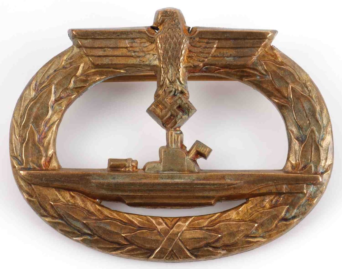 WWII GERMAN KRIEGSMARINE U BOAT BADGE: Brass badge with nice patina. W. Deumer make. Measures 1 7/8 inches. Very good condition. This lot has a reserve.