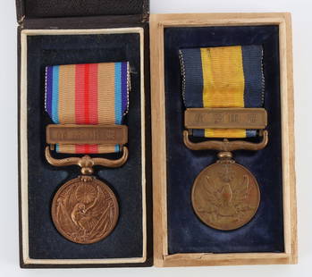 WWII JAPANESE CASED WAR MEDAL MANCHUKUO LOT OF 2: Lot of two (2) Imperial Japanese military decorations. Includes 1939 Nomonhan or Manchukuo Border Incident War Medal in wood box, as well as a 1937?1945 China Incident War Medal in original presentati