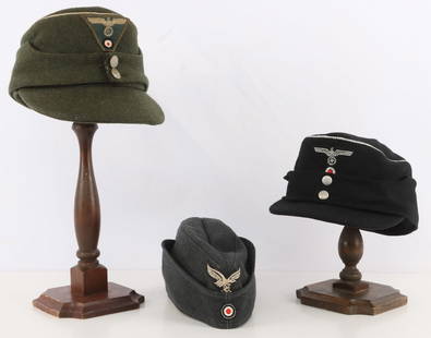 WWII GERMAN REICH HATS & CAPS LOT OF 3: Group of THREE German WWII hats: Luftwaffe EM cloth cap, Army Mountain Troops officer's M-43 cap, and Panzer soldier's M-43 cap. Unauthenticated, sold as is.