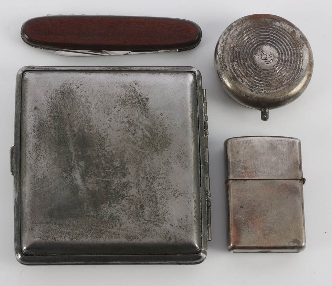 WWII GERMAN THIRD REICH PERSONAL EFFECTS LOT OF 4: 1) Stalingrad cigarette case with Reichsadler. 2) Zippo style cigarette lighter with Reichsadler and SS-siegrunes. 3) Personal ashtray with swastika. 4) Pocket knife with Sturmabteilung decal. Very go