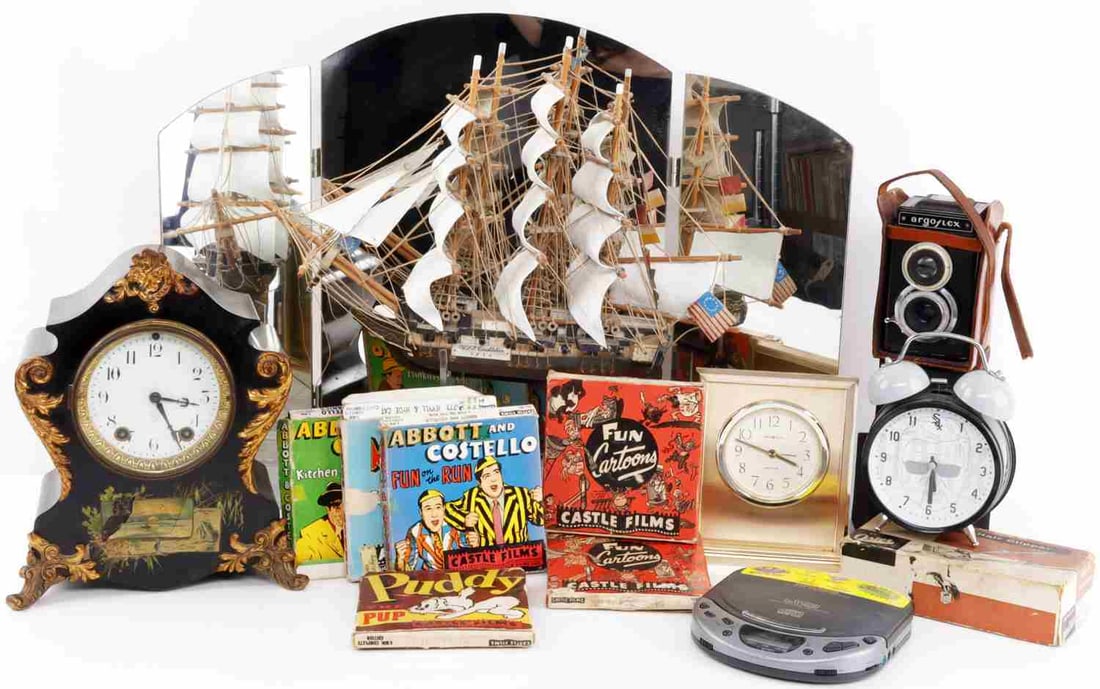COLLECTIBLE LOT MIRROR SHIP CAMERA CLOCKS FILMS: Nice variety , mirror when opened is 24 X 18, ship is USS Constitution, Castle films are the movies, the mantle clock is without pendulum, the other two will work but need batteries. Sold as is.