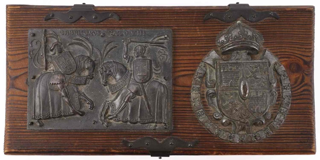 LOS CABALLEROS DE SIGLO XIII WOODEN BOX: A wooden box reading 'Caballeros Siglo XIII' ('Knights of the Thirteenth Century'). Box depicts two knights in combat as well as the coat of arms of the former Spanish kingdom of Castile and Leon. 10 