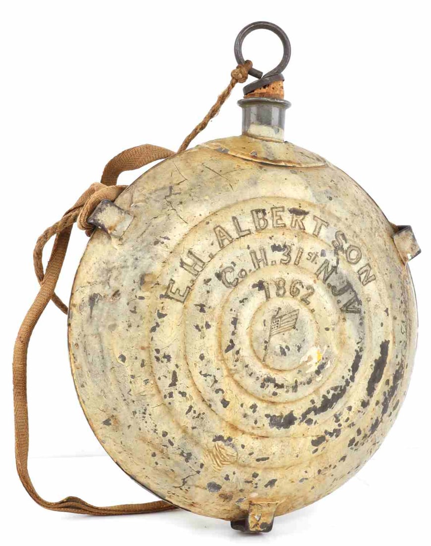 US CIVIL WAR BULLSEYE CANTEEN NAMED E H ALBERTSON: A five-ring bullseye canteen from the American Civil War. The canteen is painted a yellow-gold, possibly adopting this tone of color due to age. The paint is scratched 'E. H. Albertson Co. H. 31st NJV