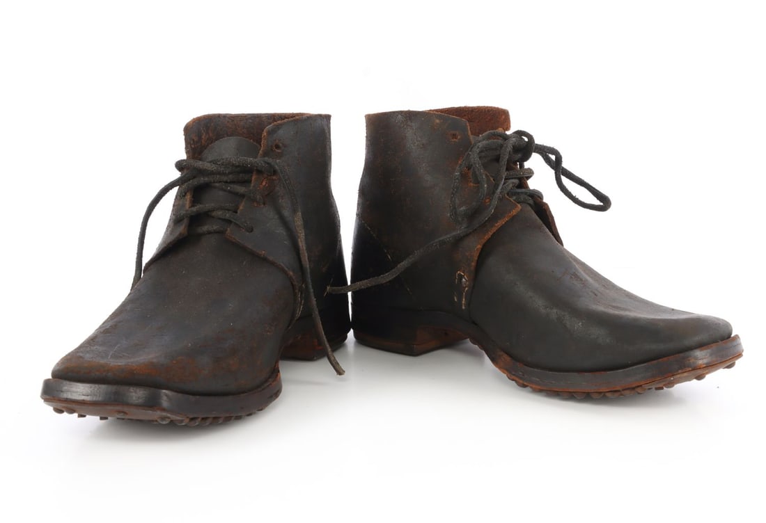 CIVIL WAR HOBNAILED BROGANS OR JEFFERSON BOOTS: Civil War brogan military boots. Leather outsoles amply hobnailed with round, pyramidal and square nails. Steel-reinforced heel and toe. Outsole of right boot is embossed "Georgetown" and both are mar