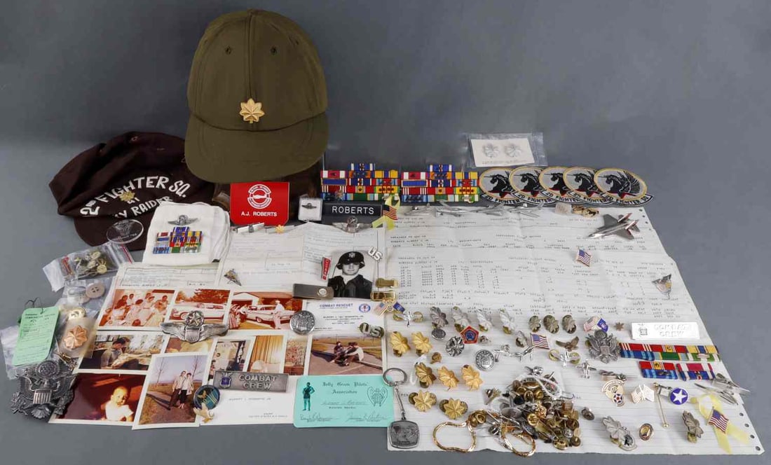 LT. COL. A.J. ROBERTS VIETNAM RESCUE PILOT INSIGNA: Multiple DFC Distinguished Flying Cross recipient, and 9 Air Medals, Highly decorated search and rescue pilot, this lot contains much of his personal insignia, wings as a command pilot, his flight rec