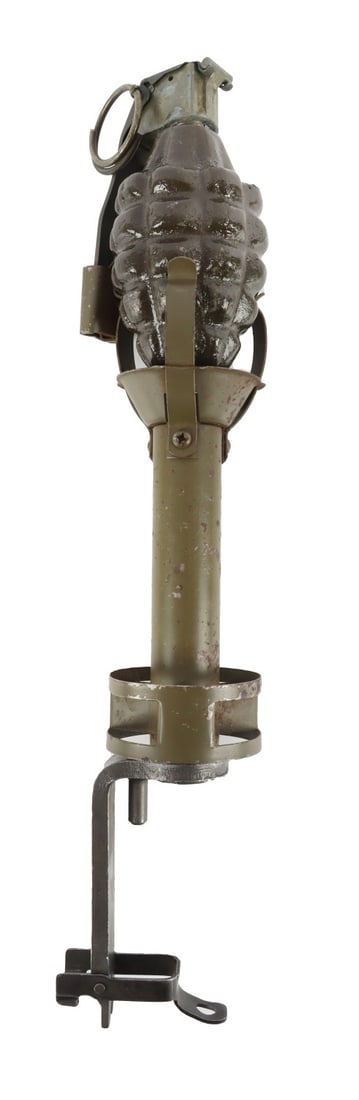WWII ORIGINAL M1 RIFLE GRENADE ADAPTER: Manufactured by IBM. Excellent condition. Three prong. Comes with demilled grenade. It measures 11 1/2 inches. From the collection of John Widdows, WW2 Collectibles. This lot has a reserve.