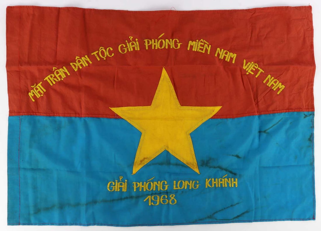 VIETNAM WAR VIET CONG CAMPAIGN FLAG: A small campaign banner for the National Liberation Front of South Vietnam, also known as the Viet Cong.