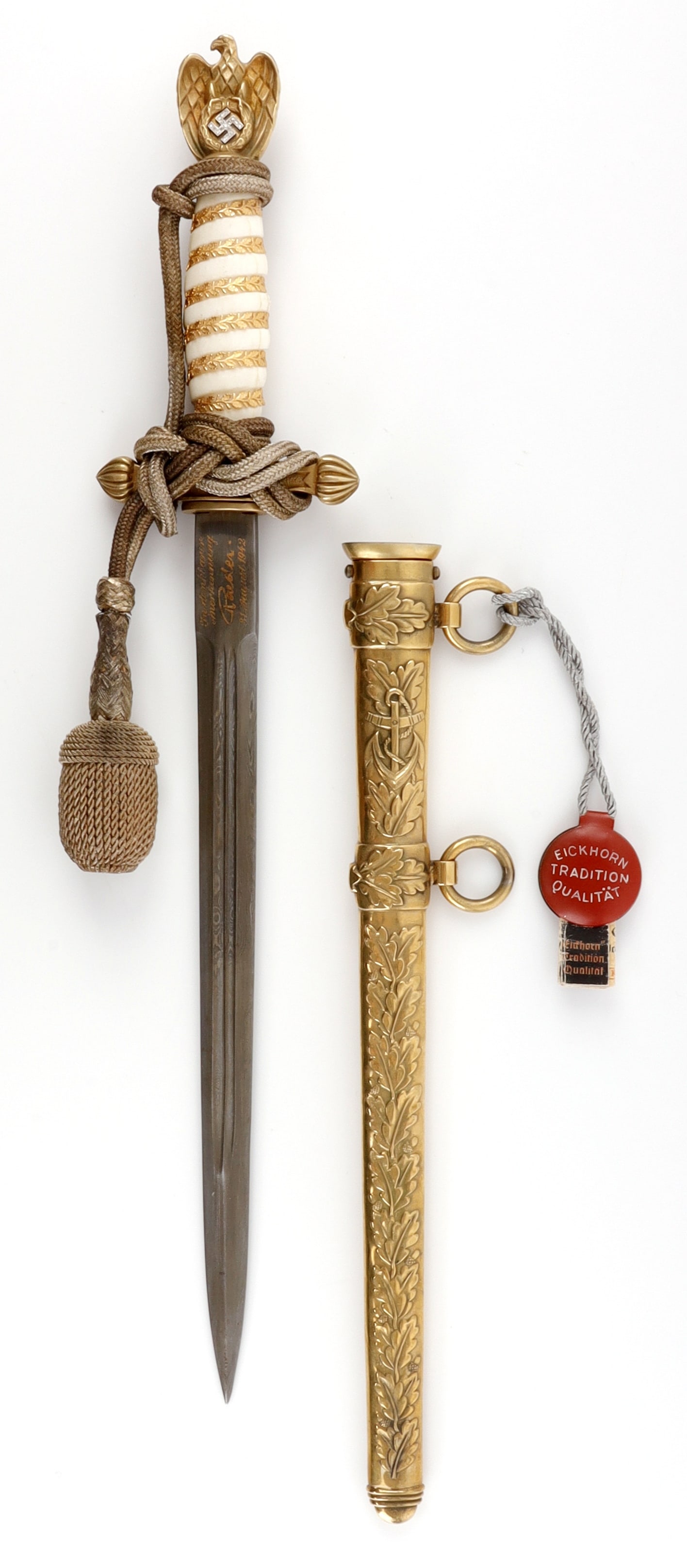 WWII GERMAN KRIEGSMARINE DAGGER WITH DIAMONDS: Damascus steel blade with with gold etched dedication at ricasso and gold etched Eickhorn stamp. Brass crossguard and pommel. Eagle features 17 round cut diamonds. Grip is wrapped in 24KT gold gilt le