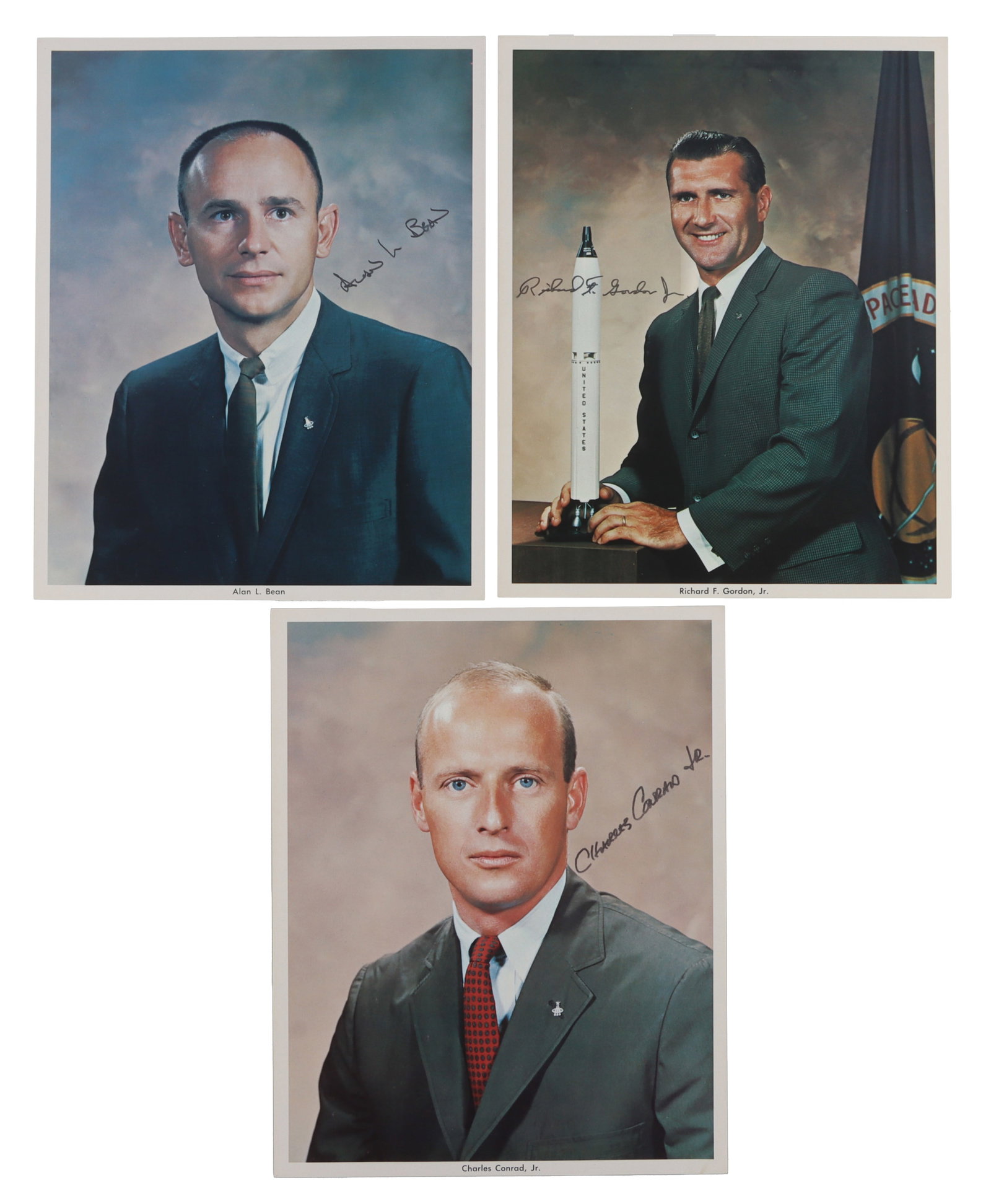 APOLLO 12 CREW SIGNED HEAD SHOT PHOTOS LOT OF 3: Three official release head shots, depicting Charles Conrad, Alan Bean, and Richard Gordon. Conrad was also command pilot of the first manned Skylab mission. Each head shot is signed by the correspond