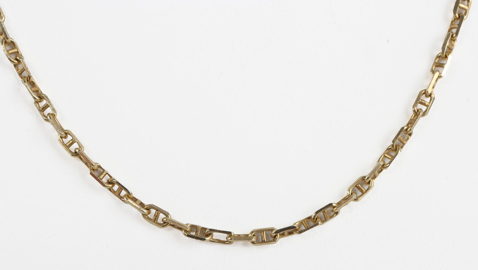 14K YELLOW GOLD ANCHOR LINK CHAIN NECKLACE 23 INCH: Stamped "14K" on clasp. In very good condition. 6.798 grams. Very heavy sturdy chain. This lot has a reserve.