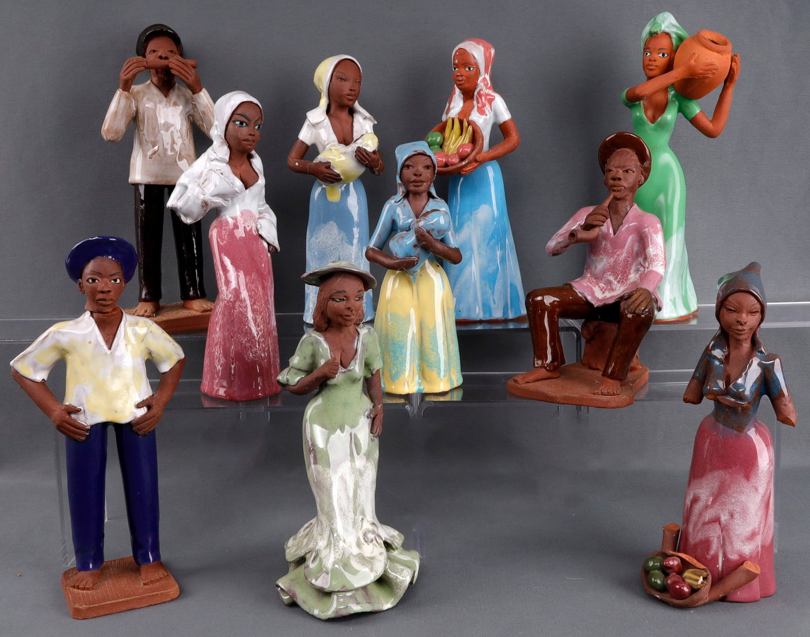 10 THINGS JAMAICAN 1986 RED CLAY FOLK FIGURINES: These came about as the result of the 1986 Jamaica floods, dated 1986, all are very good and stand 7 to 9 2/2 inches.