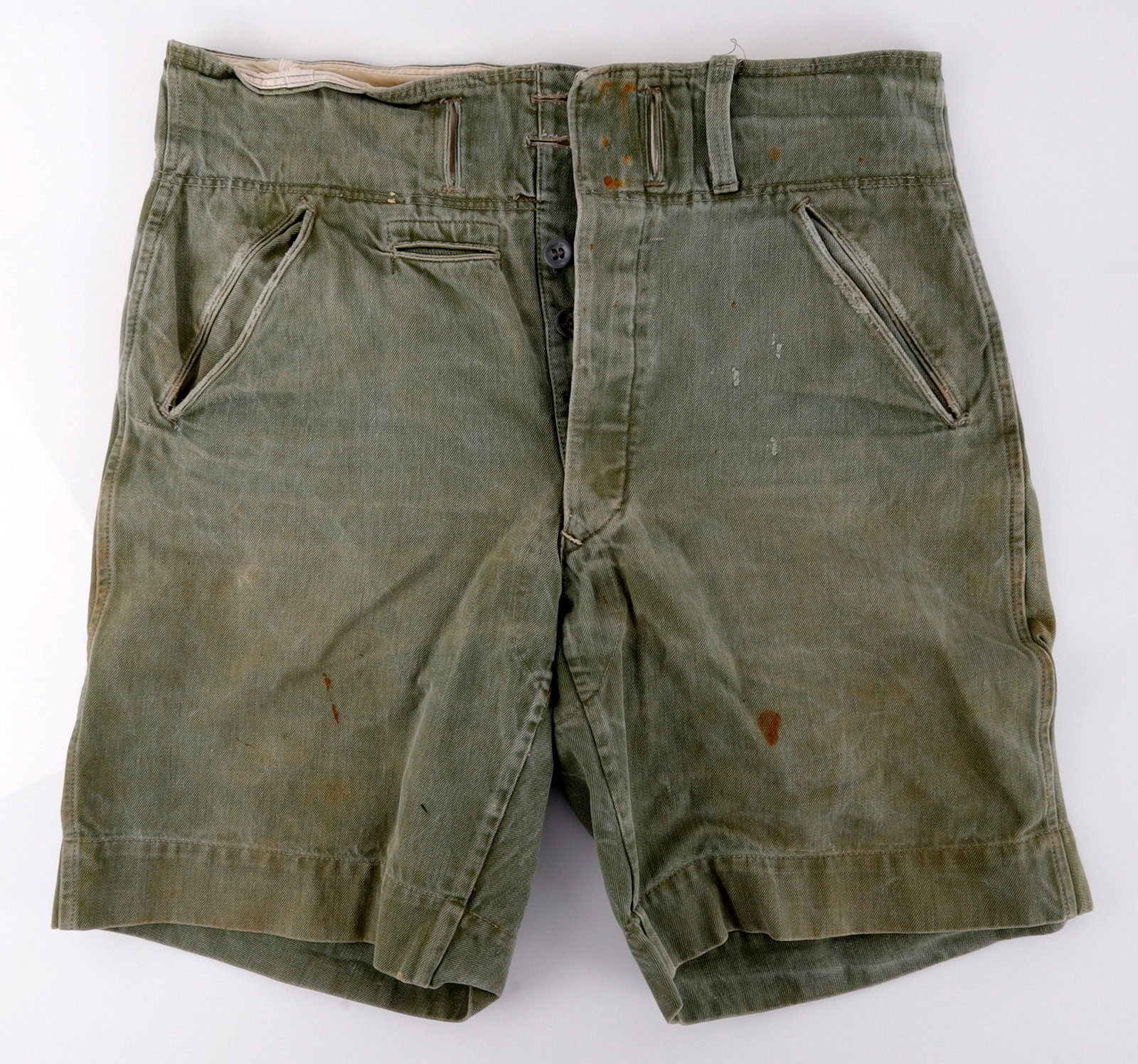 WWII GERMAN THIRD REICH DAK AFRIKA SHORTS: A pair of shorts for the German Afrika Korps. Ink stamped '22/54,' '88/102,' and 'B 41.' Some tears and staining, either iron or blood. Very good, original condition.