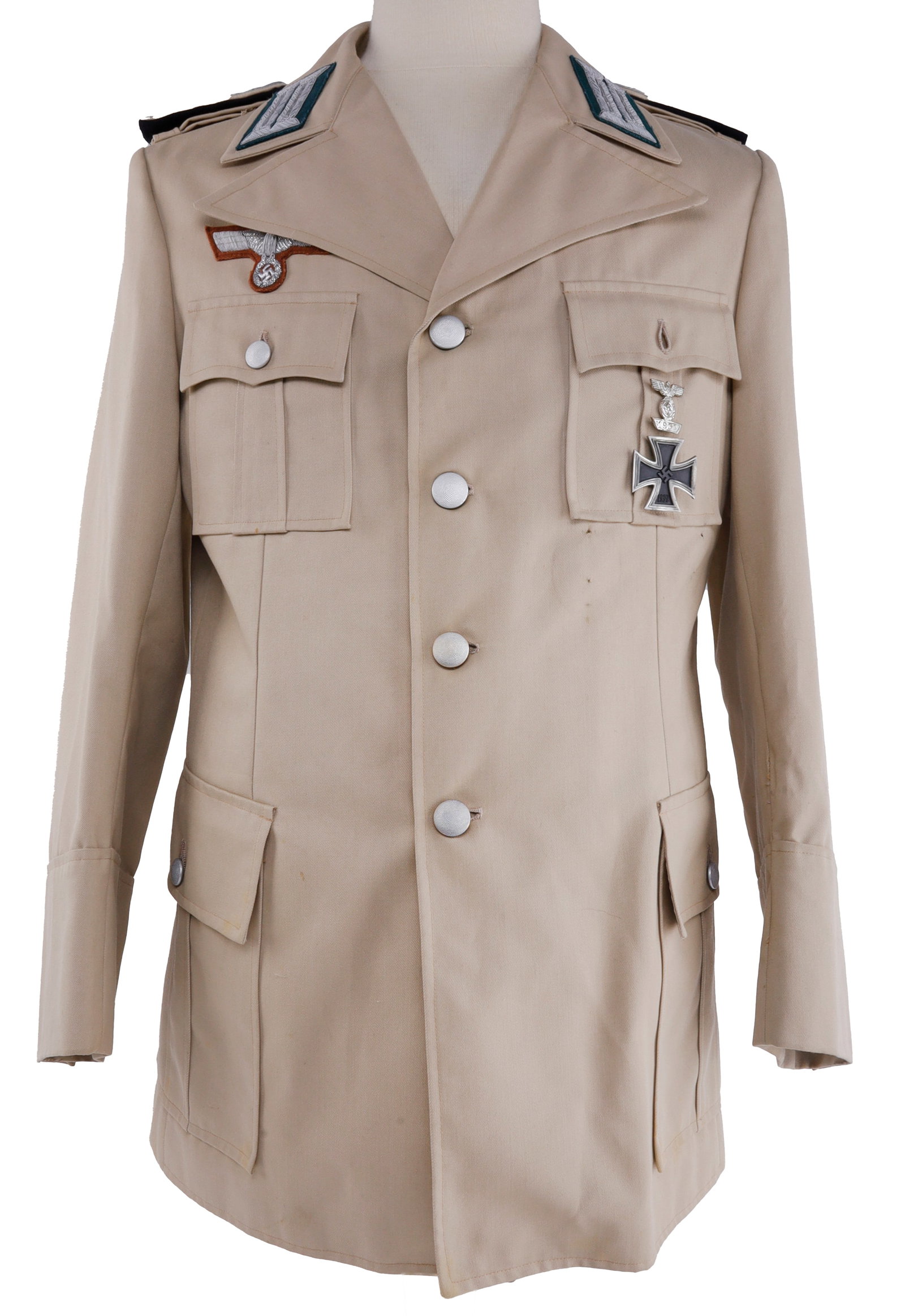 WWII GERMAN THIRD REICH TROPICAL WEHRMACHT JACKET: A tropical or desert khaki jacket for the German Wehrmacht, likely for use by the Deutsche Afrika Korps. With Iron Cross, spange, and bullion Reichsadler. Bullion Reichsadler fluoresces. 18 inches sho
