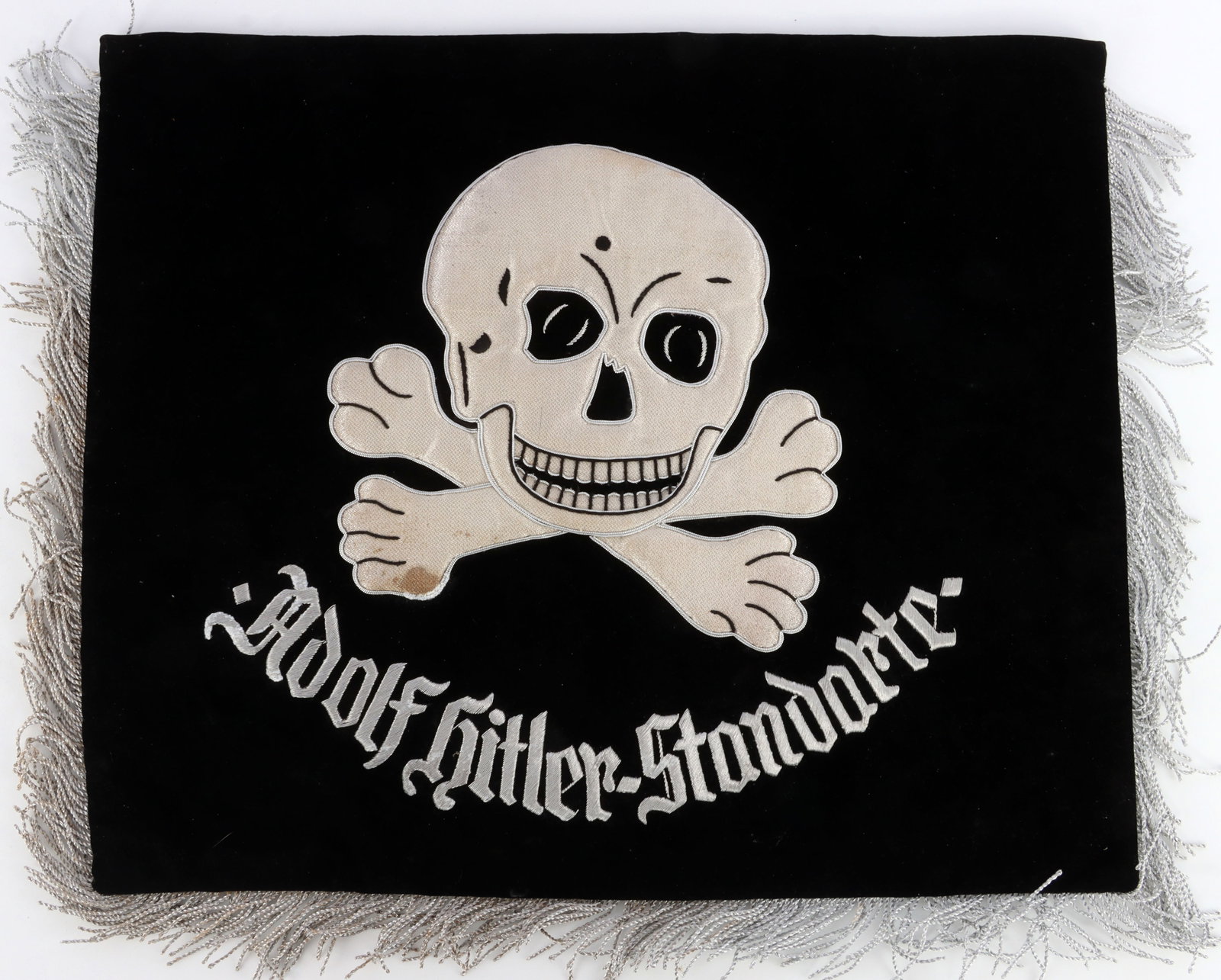 WWII GERMAN SS HITLER STANDARTE TRUMPET BANNER: Silver bullion embellishments such as SS runes, trim, fringe, and totenkopf. Black velvet cloth. It measures 16X19 inches. Fluoresces. Unauthenticated, sold as is.