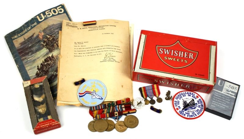 USN CREW MEMBER U-505 CAPTURE CITATION & MEDALS: Grouping of USN crew member citation and medals from U-505 capture includes Merle H. Revels Presidential Unit Citation award while a member of USS Guadalcanal Task Force, newspaper clippings, The Stor
