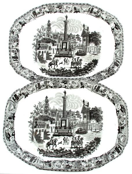 TWO 19 INCH VICTORIA WARE IRONSTONE PLATTERS: Both measuring 19 by 14 inches these two Victoria Ware Ironstone platters feature a Mexican village scene in the center in flow black transfer. There is also a mixture of flowers, birds, forts, and pa