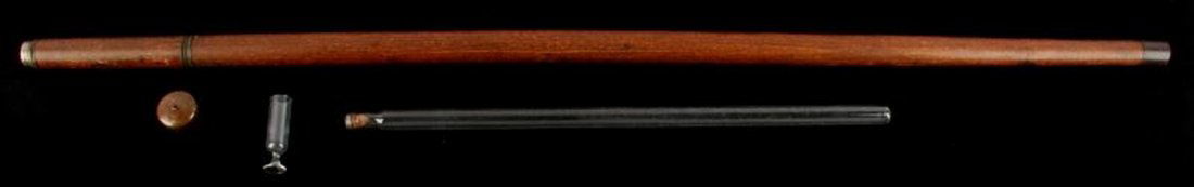 19TH CENTURY MALACCA CANE FLASK: 34.75 inch Malacca flask cane c. late-19th century with 2.1 inch blown cordial glass, 15 inch blown test tube-style flask with cork, copper-alloy hardware (handle, ferrule, and collar). No chips or cr