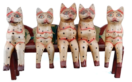 FIVE RUSTIC FOLK ART CATS SITTING ON A BENCH