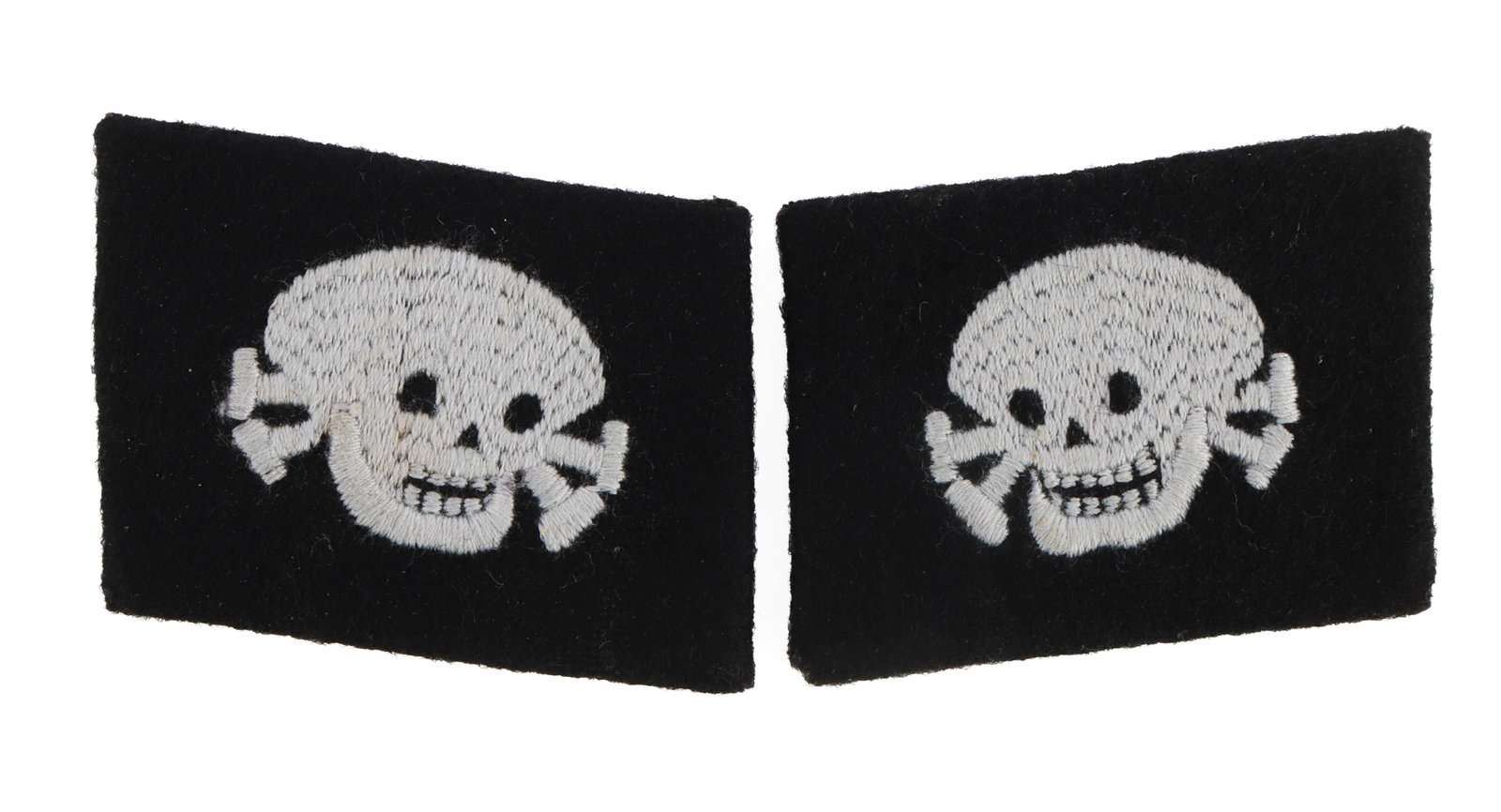 WWII GERMAN SS PUMPKIN HEAD COLLAR TAB SET: Black wool over buckram backing. Pumpkin head style Totenkopf. They measure 2 1/4 inches. This lot has a reserve.