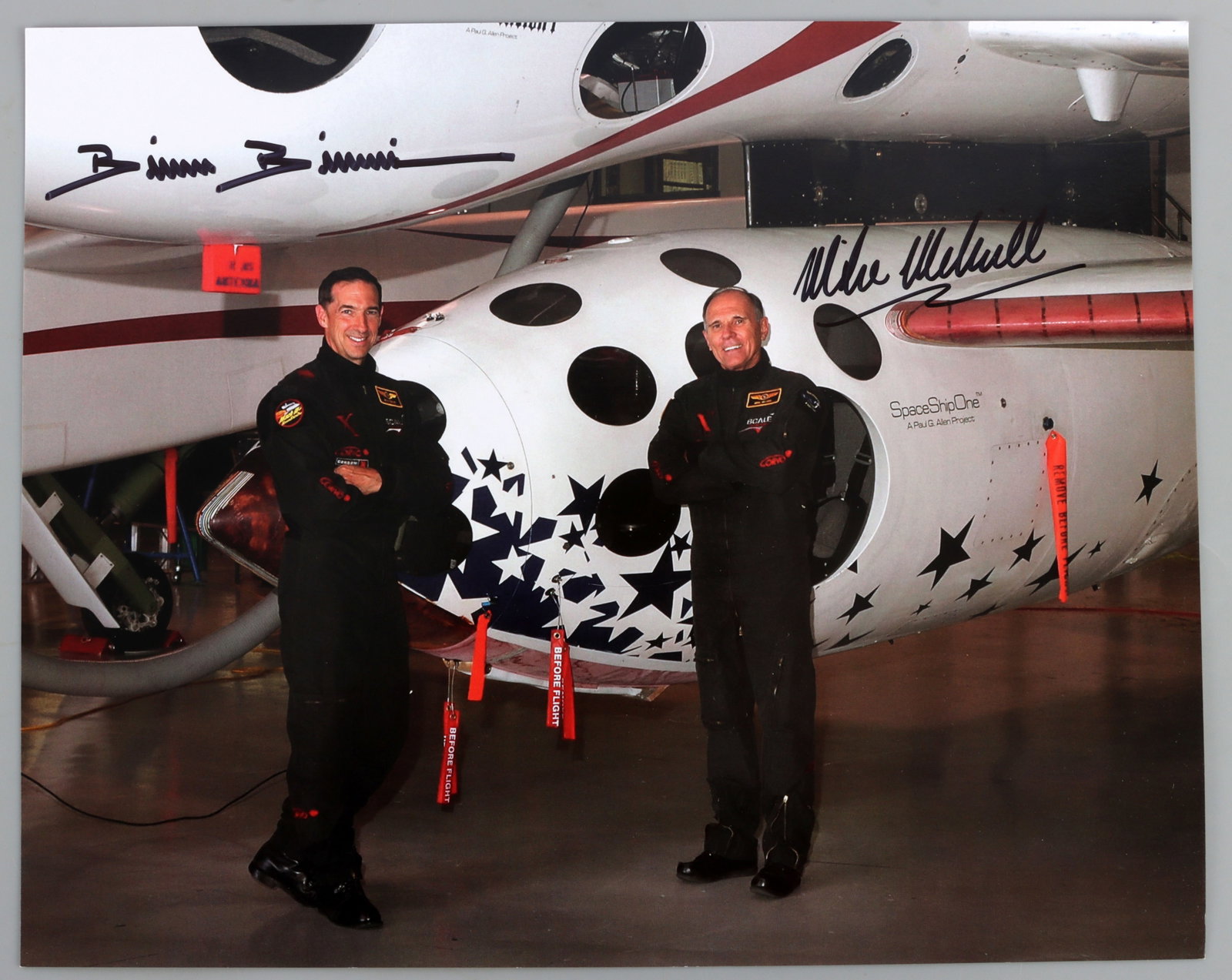 BRIAN BINNIE & MIKE MELVILLE AUTOGRAPHED PHOTO: A photograph signed by Brian Binnie and Mike Melville, the pilots of SpaceShipOne. Very good, original condition.