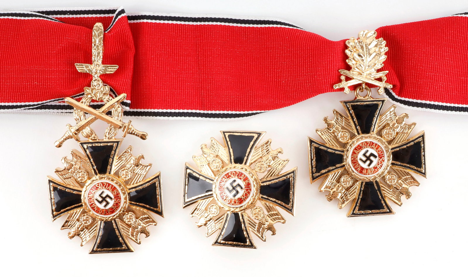 WWII GERMAN THIRD REICH GERMAN ORDER LOT OF 3: Three high ranking decorations for the German Third Reich. 1) German Order, third class. 2) German Order with oak leaves and swords. 3) German Order. Unauthenticated, sold as is.
