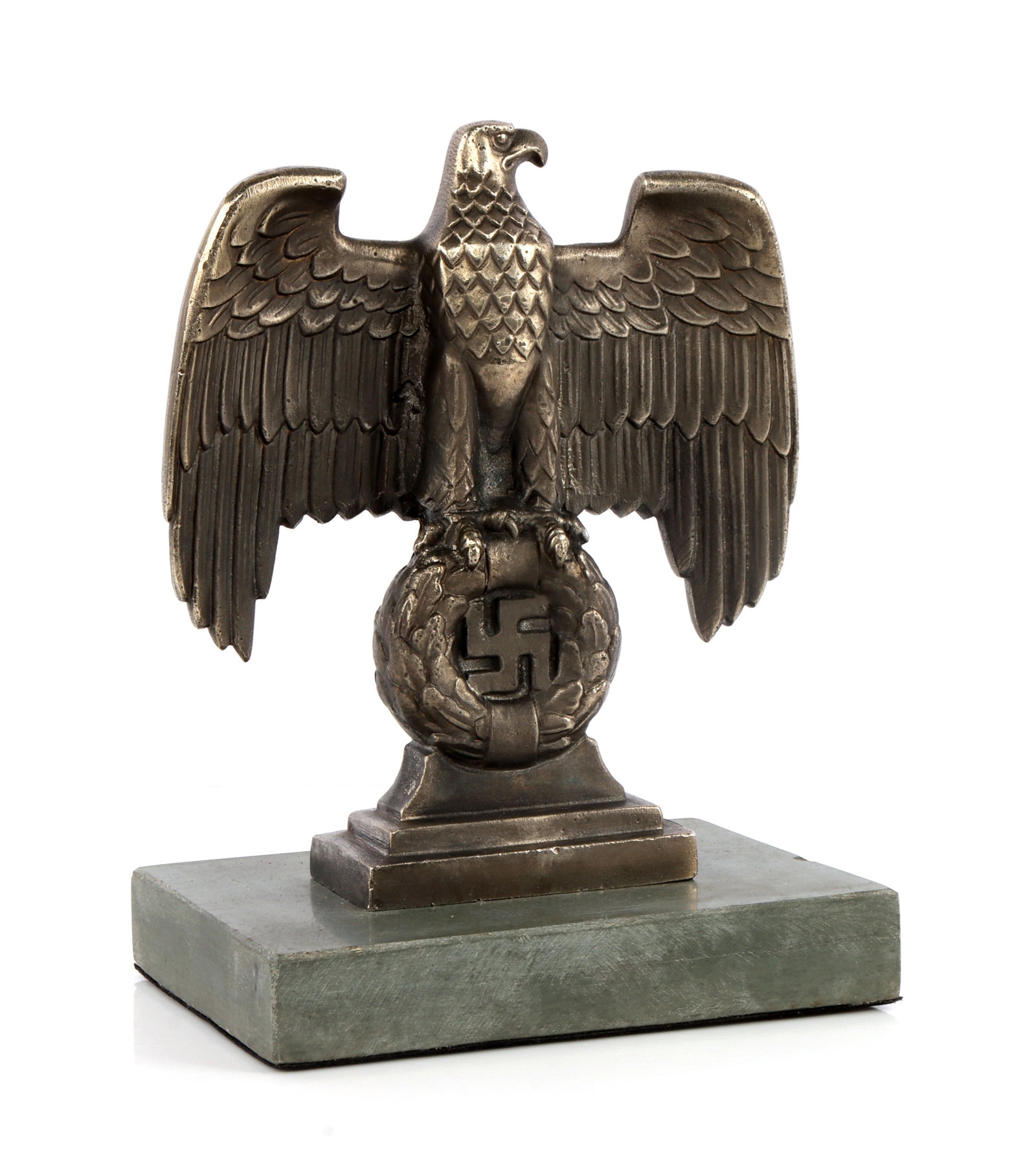 WWII GERMAN THIRD REICH NUREMBERG DESK EAGLE: A Nuremberg eagle desk bust, showing the Nuremberg Reichsadler with swastika on a mount. 6 X 8 X 4 inches. Very good, original condition.