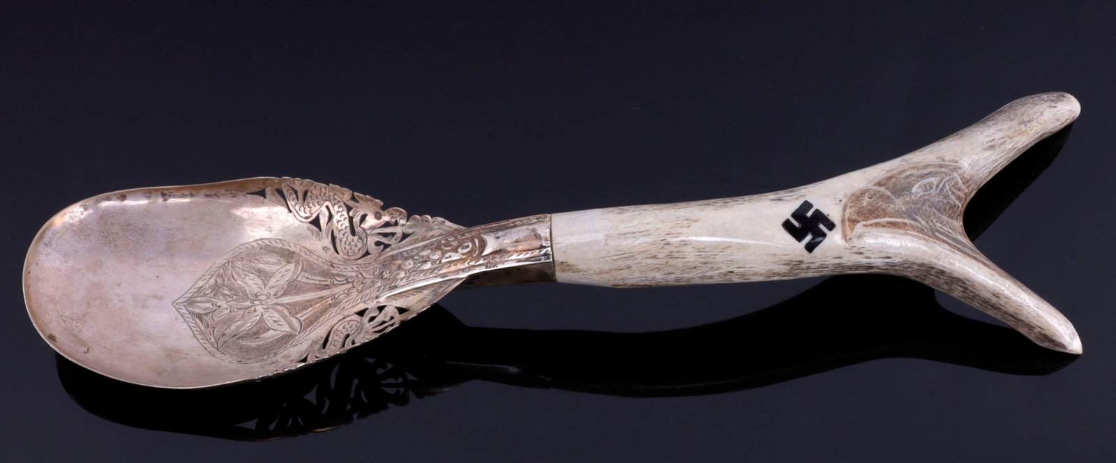 WWII GERMAN HUNTING ASSOCIATION SERVING SPOON: Silver plated spoon with stag handle. Eagle carved into handle with inlaid swastika. Measures 11 3/4 inches. Contemporary piece.