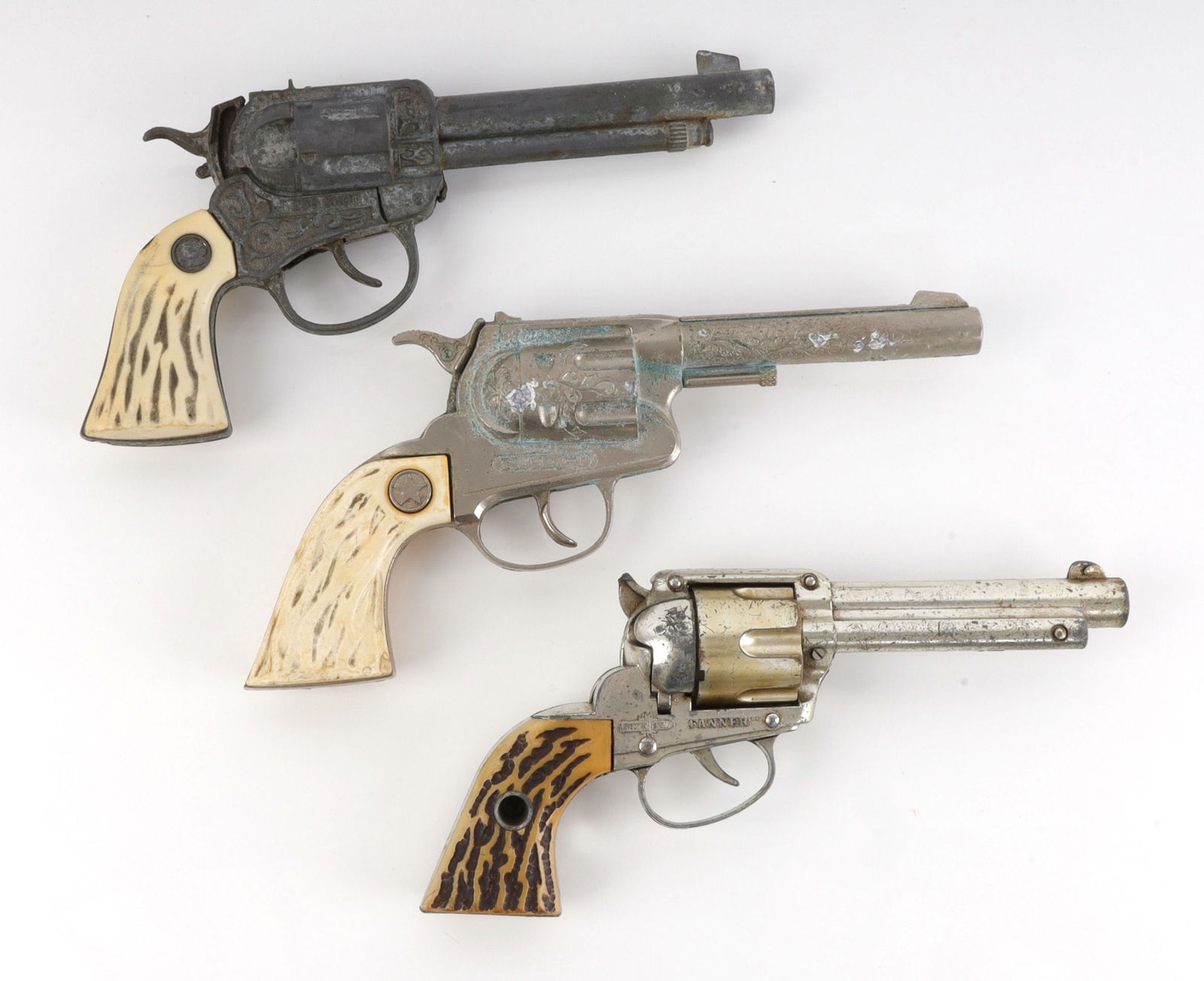VINTAGE TOY CAP GUNS LOT OF 3: Three vintage cap guns. 1) 250 Shot, no maker. 2) Danner Shootin' Shell. 3) Halco Ranger.