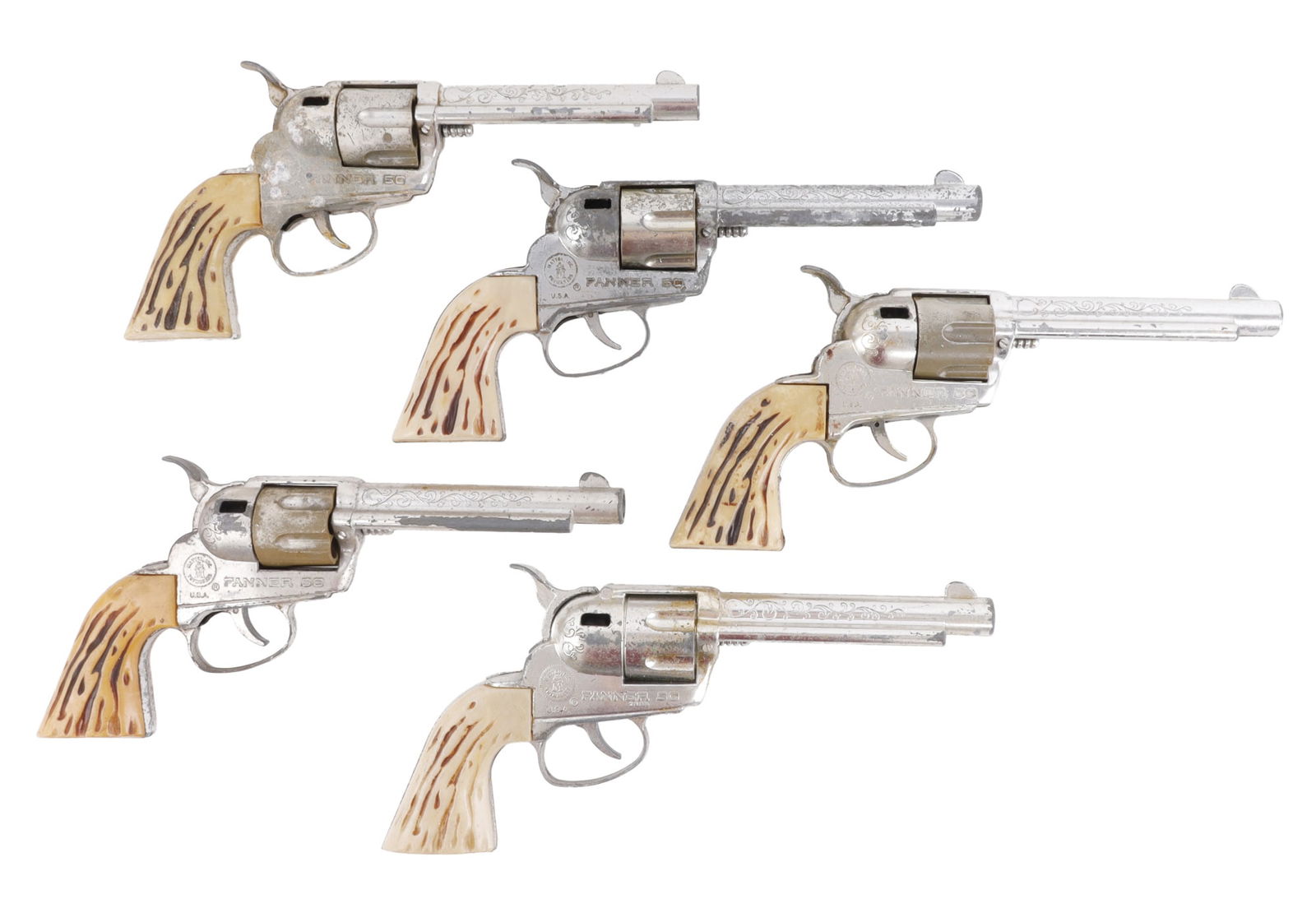 FANNER 50 NICKEL-TONE CAP GUNS LOT OF 5: Five nickel-tone Fanner 50 cap guns. Various stages of condition, with some loss of tone and some having a small amount of shakiness. Good, original condition.
