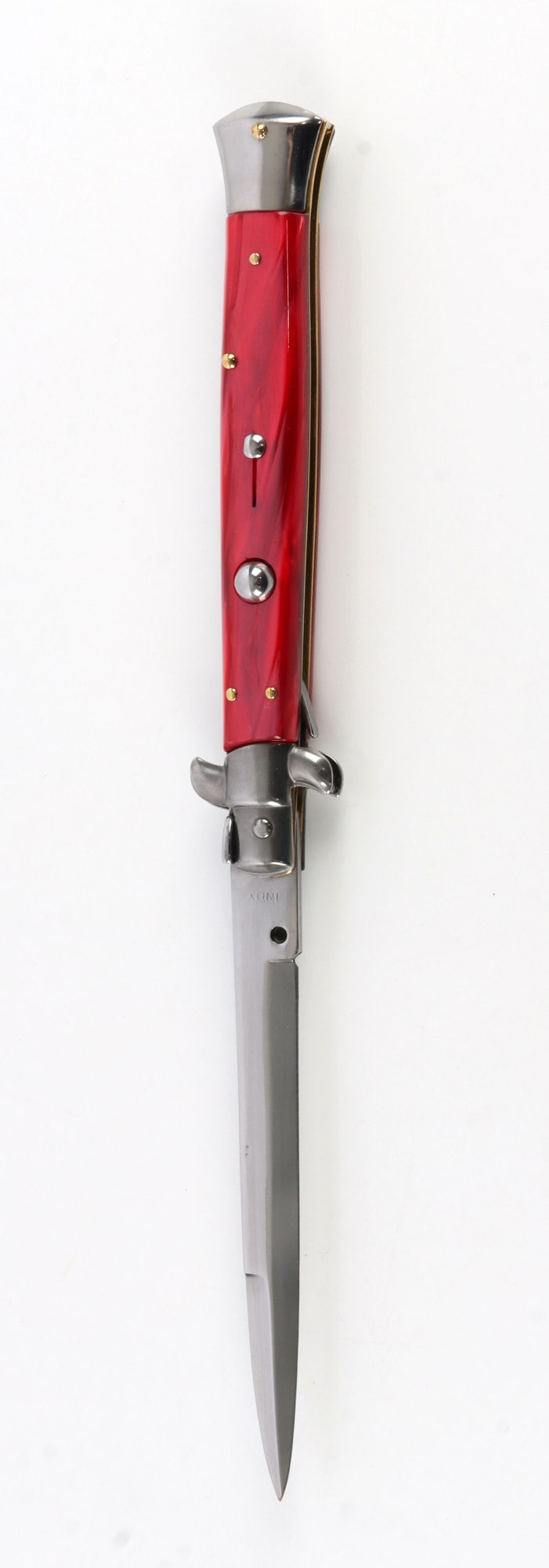 ITALIAN INOX SWITCH BLADE AUTOMATIC KNIFE: An Italian made stiletto switch blade, marked Inox. Red pearlescent handle. 5 inch blade. Very good, original condition.