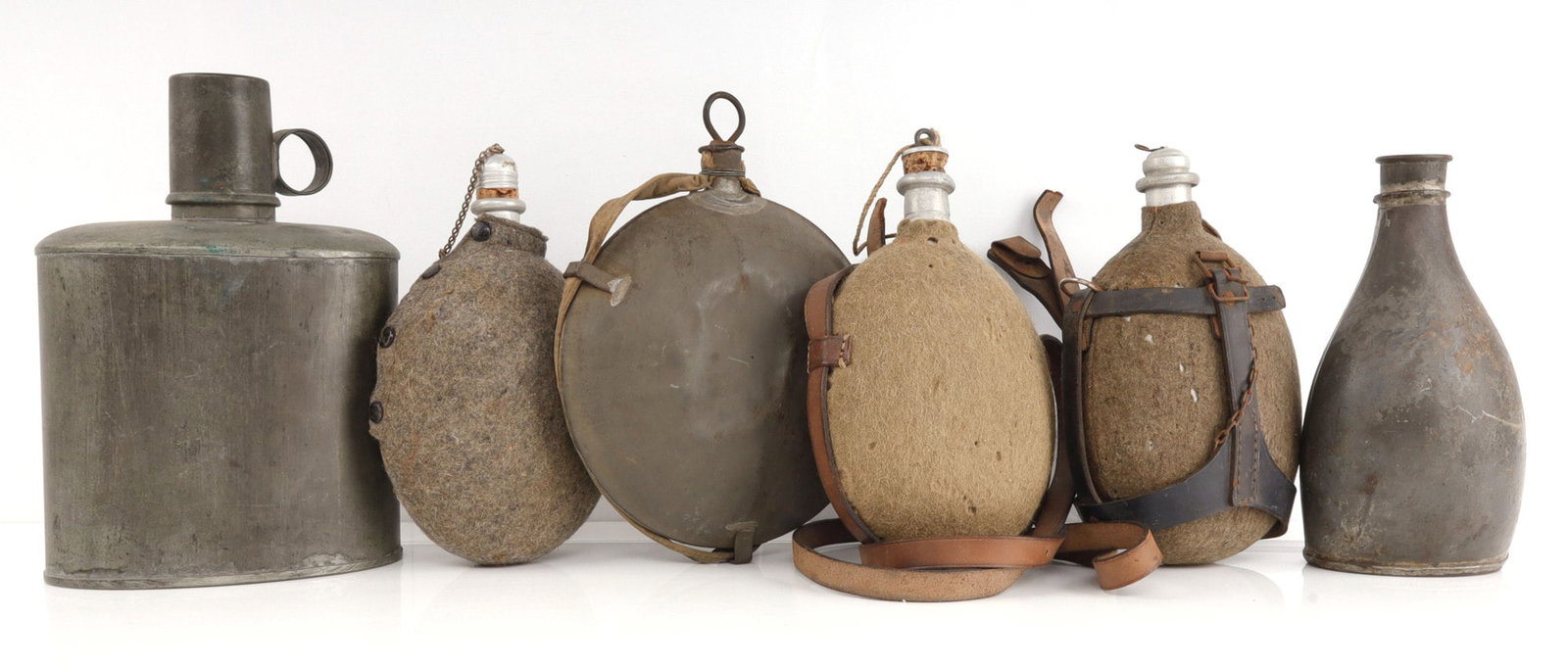 6 CANTEEN LOT US CIVIL WAR HOLLAND ENGLAND GERMAN: The Civil War one has tag stating it was "carried by Norman E. Spencer, 179th Pa. Drafted Militia", not verified, the Brit on is Broad Arrow marked, Johnson Brothers, very good and original. Only the 