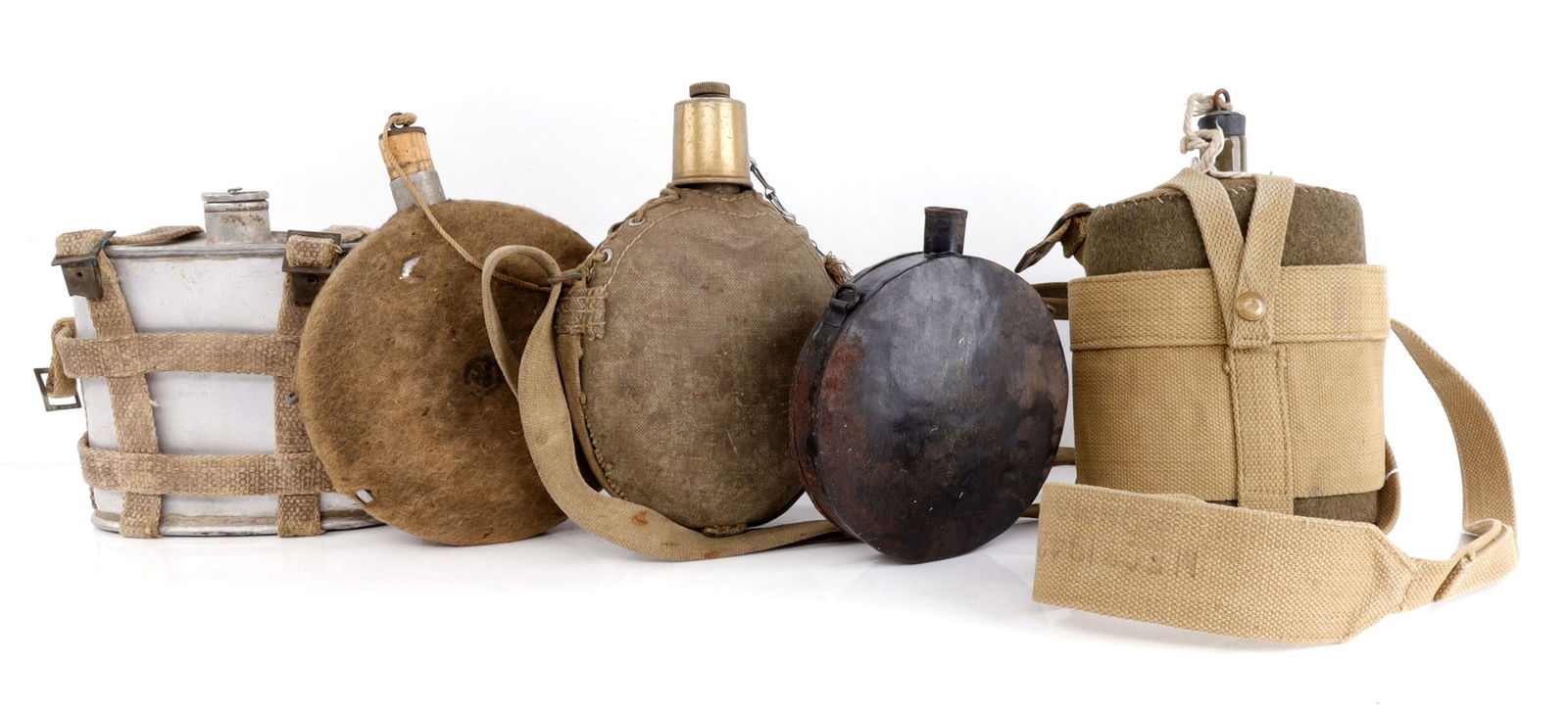 LOT OF 5 ANTIQUE MILITARY CANTEEN LOT EURO MIX: Includes a 1942 dated on strap British canteen, that appears mint and unissued, plus another covered, with Broad Arrow, North Africa Italian, and early painted black possible Civil War canteen