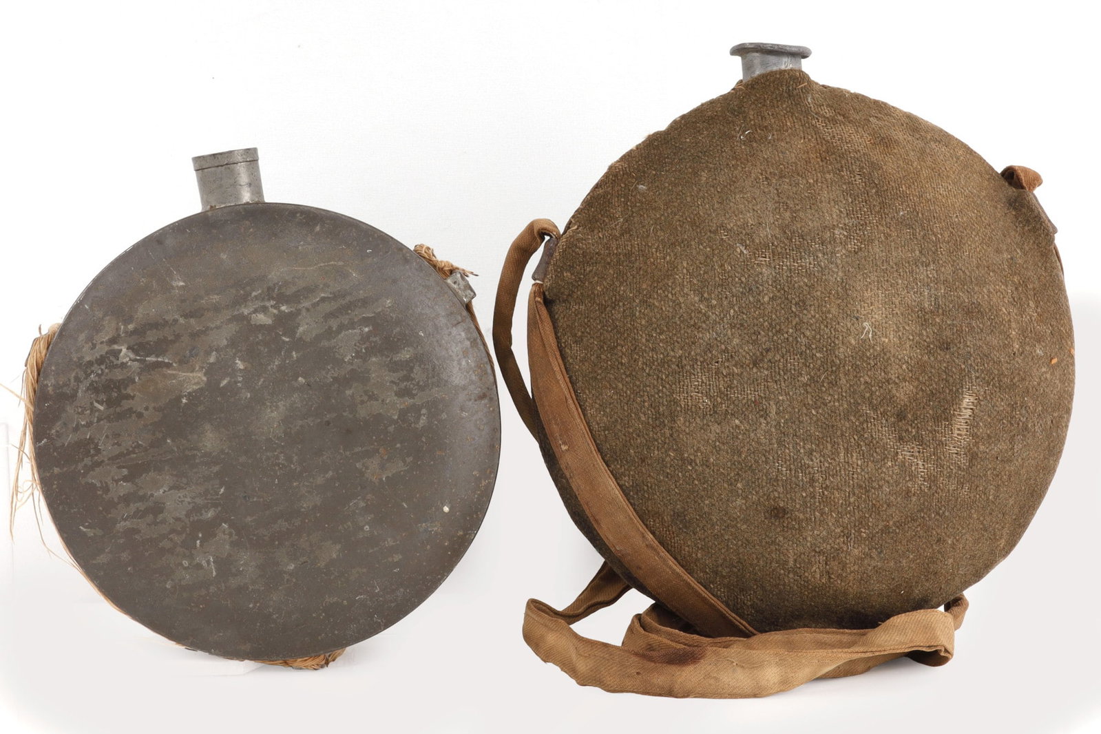 1 CONFEDERATE & 1 UNION CIVIL WAR CANTEEN LOT: Union is crossed rifle Inf. stamped, Confederate is etched co 24, hard to see. Neither have spouts.