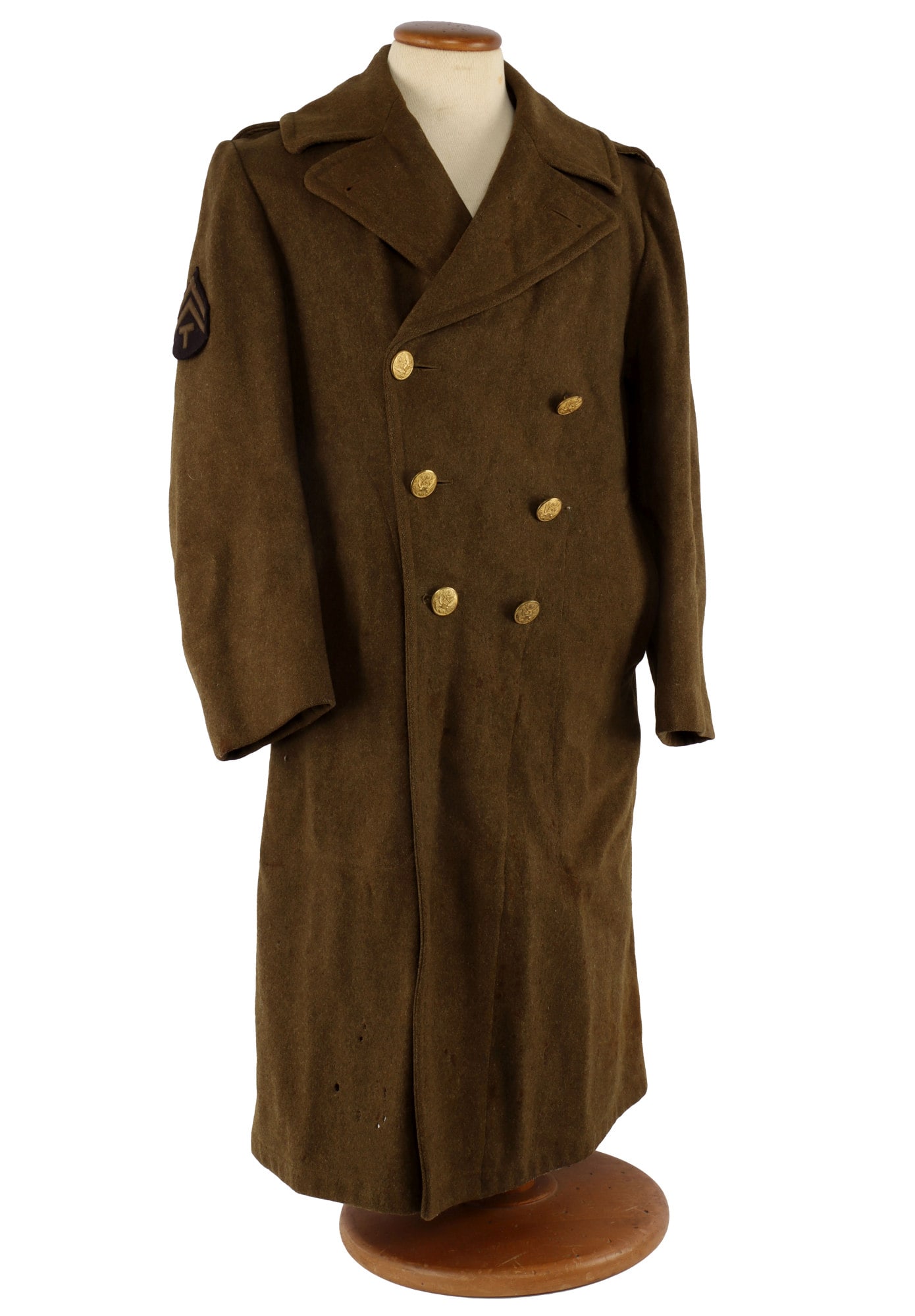 WWII US ARMY SERVICE FORCES WOOL OVERCOAT: Wool overcoat, size 38S, dated 1942. Left shoulder has insignia patch of the Army Service Forces. Very good condition.