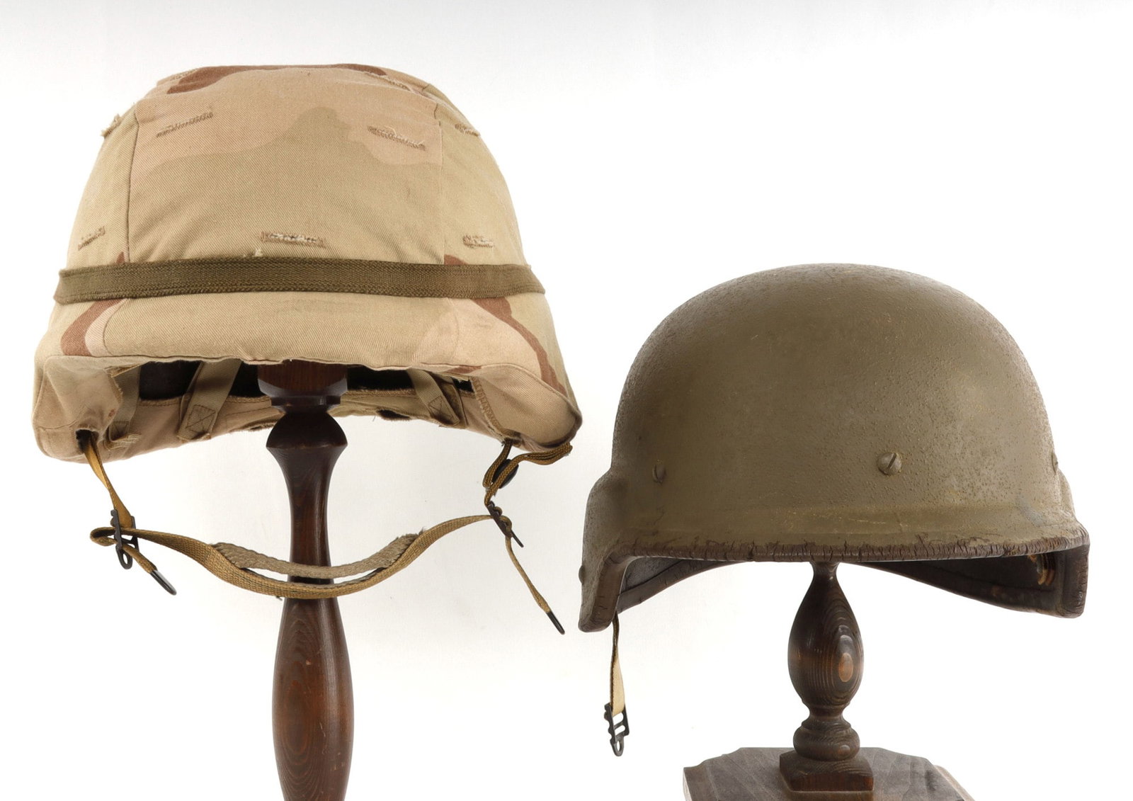 2 DESERT STORM PASGT HGELMET LOT 1 W DESERT CAMO: The Camo covered helmet has chin strap., liner ids complete and very good, the uncovered has liner and no chin strap, and more wear