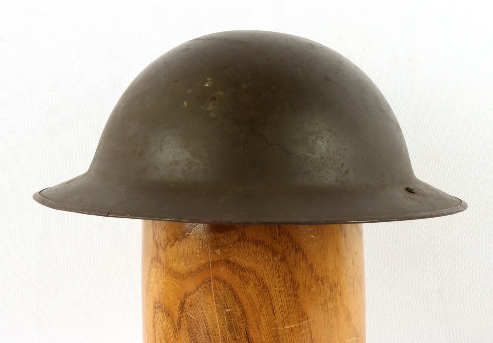 BELGIAN MK II BRODIE STEEL COMBAT HELMET: Complete, with chinstrap and liner. Liner marked size 57 and "COMET ABL 50." Exterior has Belgian flag decal. Very good condition.